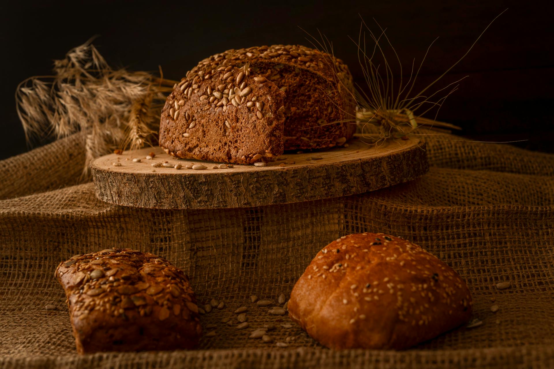 Wholegrain sourdough loaves on a rustic wooden surface